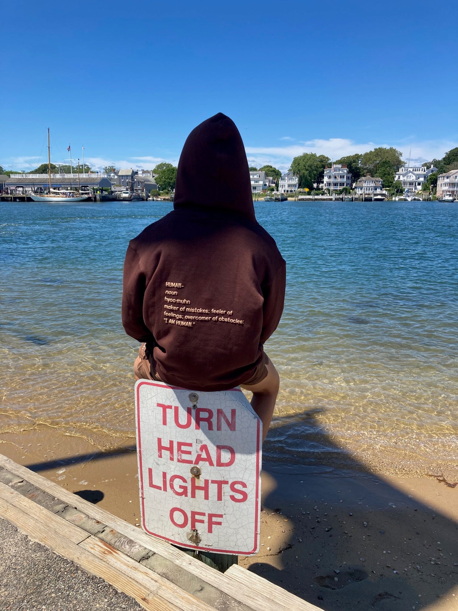 Back view of Robbie in size medium brown human definition hoodie. 