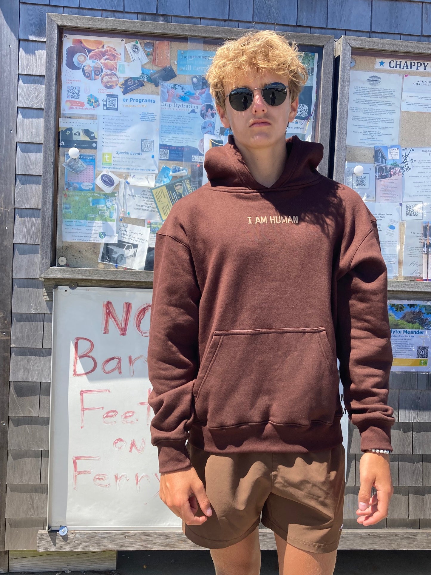 Robbie in medium brown human definition hoodie.